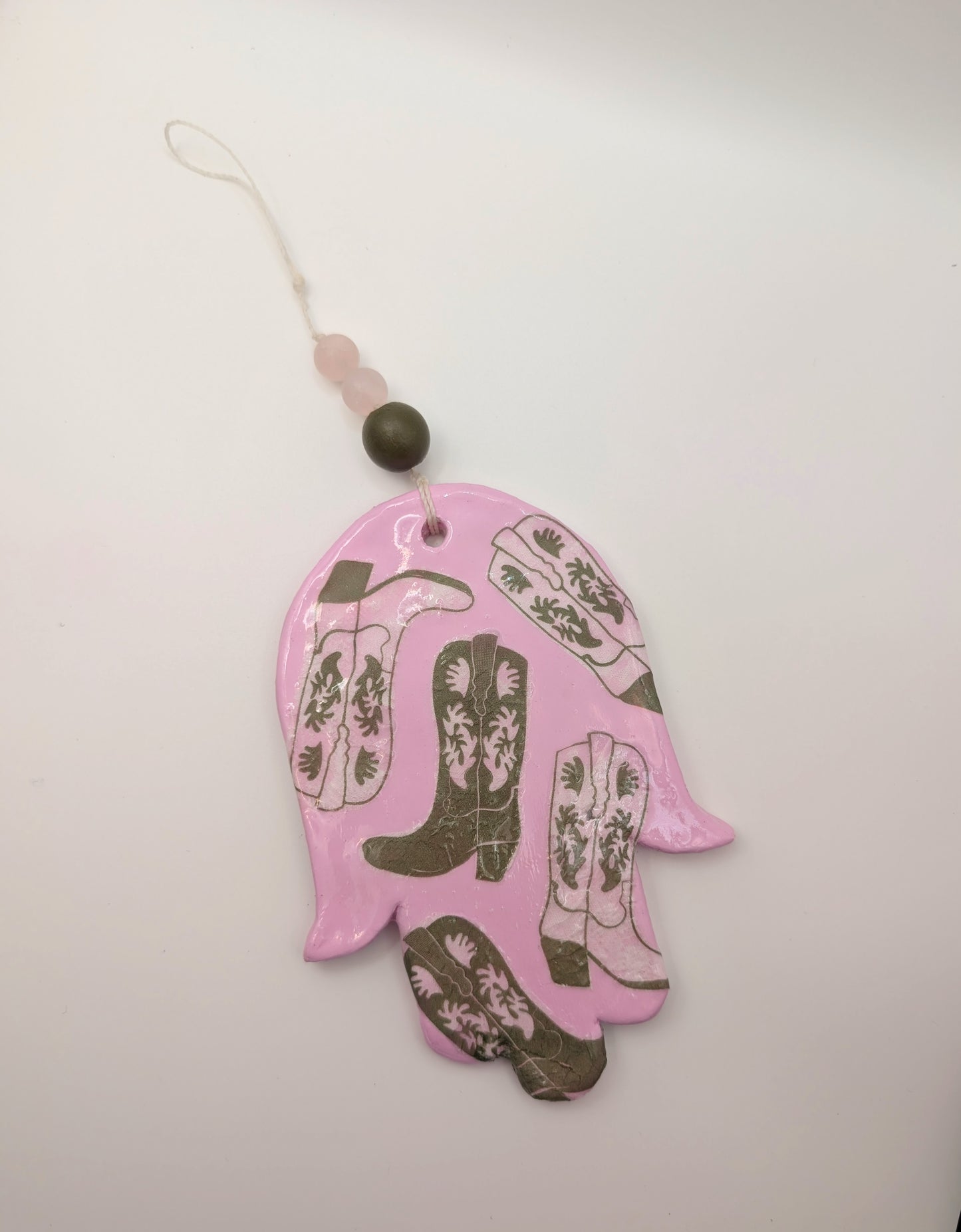 Hamsa wall art in pastel pink with olive cowboy boots