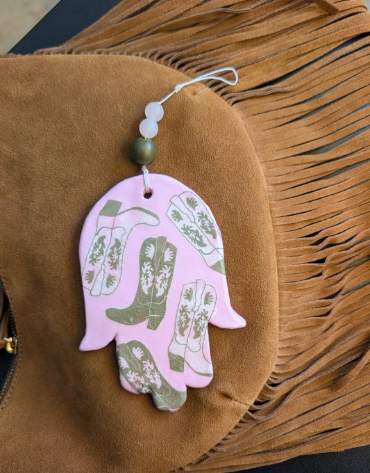 Hamsa wall art in pastel pink with olive cowboy boots