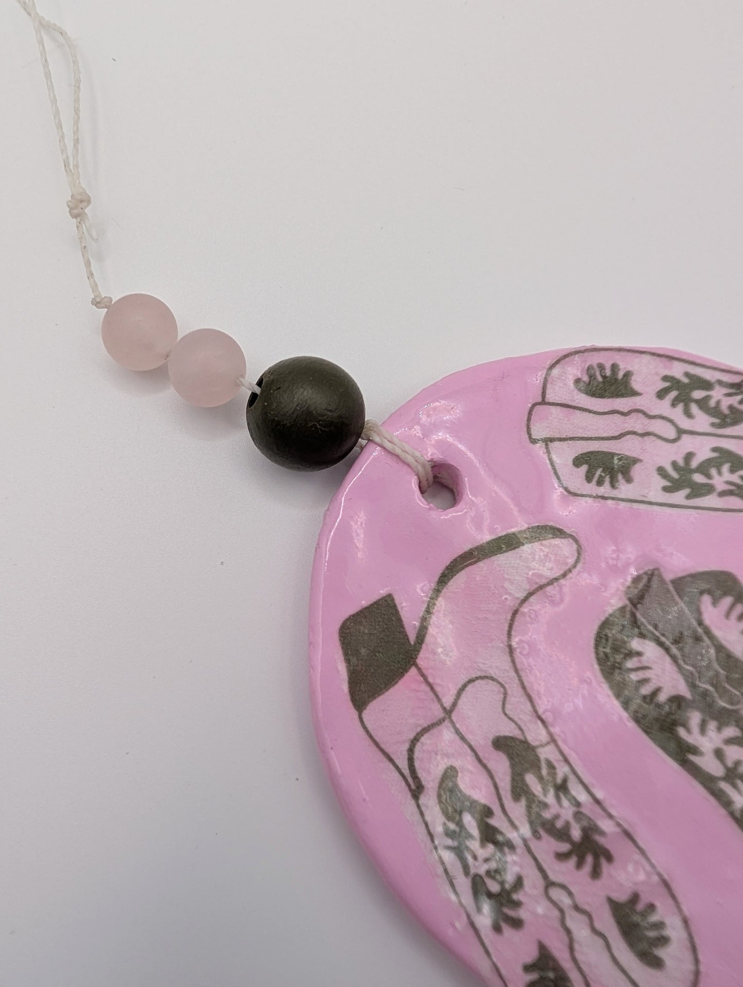 Hamsa wall art in pastel pink with olive cowboy boots