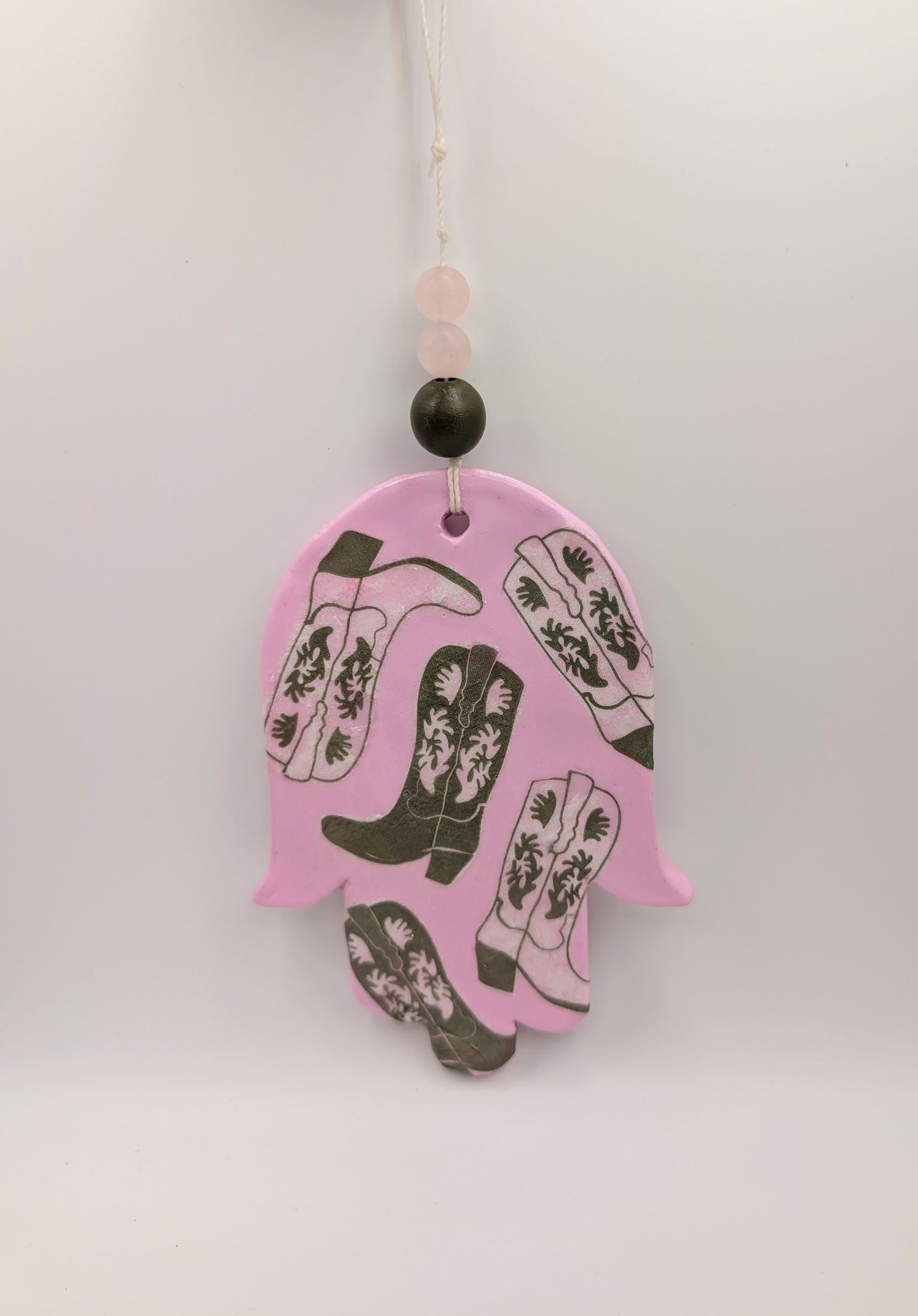 Hamsa wall art in pastel pink with olive cowboy boots